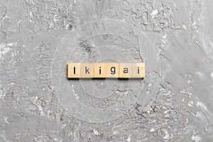 Ikigai word written on wood block. ikigai text on table, concept photo