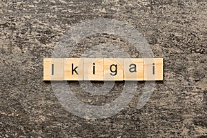 ikigai word written on wood block. ikigai text on table, concept photo
