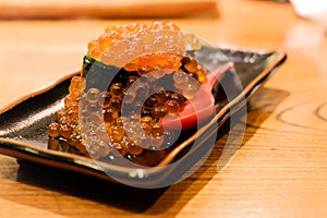 Ikura Gukan, Salmon Roe Sushi, Blur Background photo