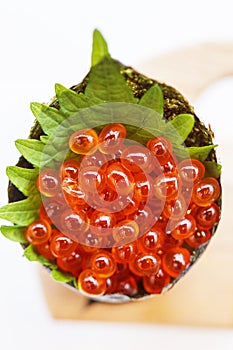 Ikura Salmon Roe Tempura California or Temaki Sushi Hand Roll on Wood Stand