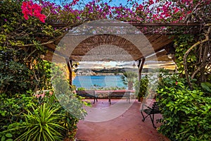 Il-Mellieha, Malta - Beautiful balcony and benches surronded by flowers with Mellieha town