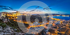 Il-Mellieha, Malta - Beautiful panoramic skyline view of Mellieha town after sunset with Paris Church and Mellieha beach