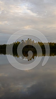 Iland in tmorning.the glassy lake.