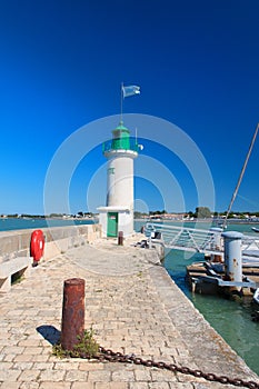 Ile de Re - lighthouse and boats in harbor of La Flotte photo