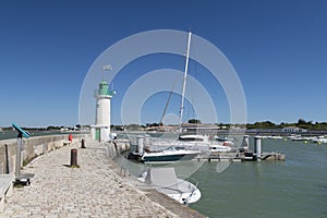 Ile de Re - lighthouse and boats in harbor of La Flotte photo
