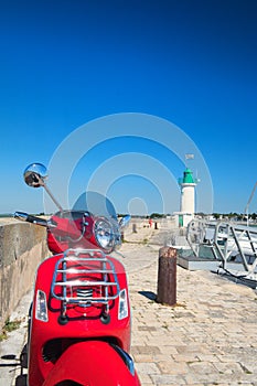 Ile de Re - scooter in harbor of La Flotte photo