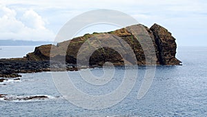 Ilheu de Rosto de Cao, Dog Face Islet, on the south coast of the island of Sao Miguel, Azores, Portugal photo