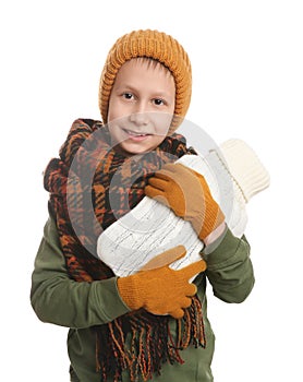 Ill boy with hot water bottle suffering from cold on white background