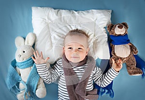 Ill boy lying in bed