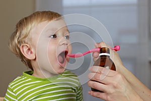 Ill child with cough syrup