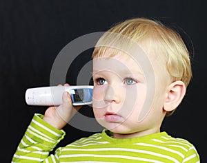 Ill child and thermometer