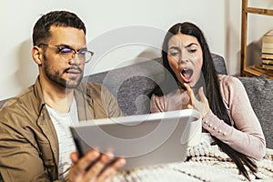 Ill couple having medical teleconsultation using digital tablet at home photo