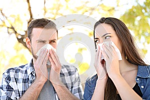Ill couple suffering contagious flu outdoors photo