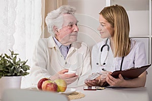 Ill elderly man with medicines