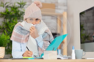 ill female office worker at office photo