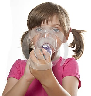 Ill little girl using inhaler