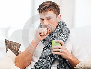 Ill man with flu at home photo