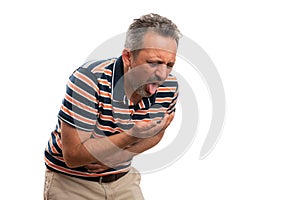 Ill man having indigestion making puke gesture with copyspace