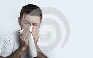 Ill man sneezes photo