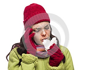 Ill Mixed Race Woman Blowing Her Sore Nose with Tissue