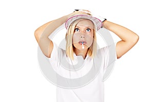 Ill never find that ball again. Studio shot of a wide-eyed female golfer with her hands behind her head and a tee in her