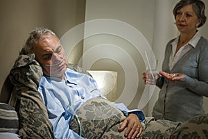 Ill old male patient and caring wife