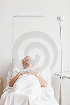 Ill Senior Man in Hospital Bed