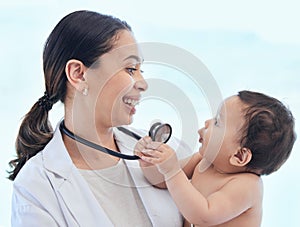 Ill show you how to do your job better. a paediatrician examining a baby in a clinic.