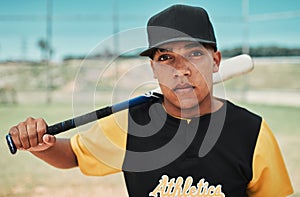 Ill show you how to win a game. Shot of a young baseball player holding a baseball bat while posing outside on the pitch