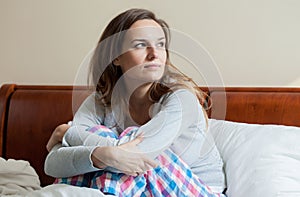 Ill woman in bed during morning