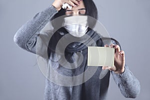 Ill woman holding card or paper