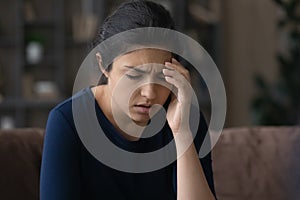 Ill young Indian woman suffer from headache