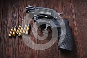 illegal handgun on wooden table