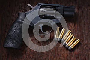 illegal handgun on wooden table