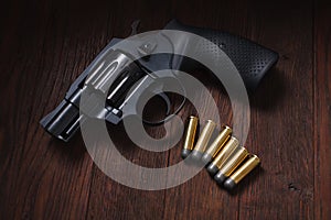 illegal handgun on wooden table