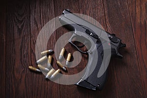 illegal handgun on wooden table photo