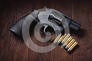 illegal handgun on wooden table photo