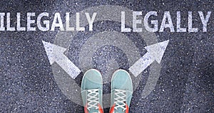 Illegally and legally as different choices in life - pictured as words Illegally, legally on a road to symbolize making decision photo