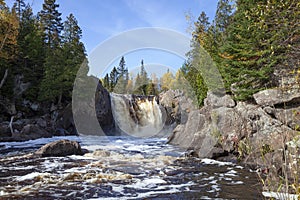 Waterfall on a river 0n the north shore of Minnesota during autumn photo