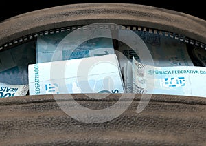 Illicit Cash In A Brown Duffel Bag photo