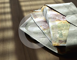 Illicit Rupee Banknotes In Envelope