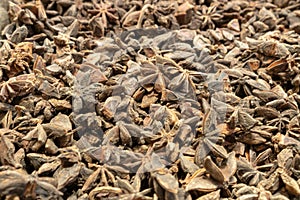 Illicium verum - a spice commonly called star anise, staranise, star anise seed, Chinese star anise, or badian. Top view blur