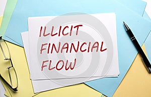 ILLICT FINANCIAL FLOW text on paper on the colorful paper background