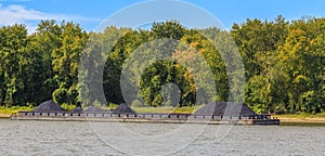 Illinois River Barge Loaded with Coal Awaiting Transport via a Towboat