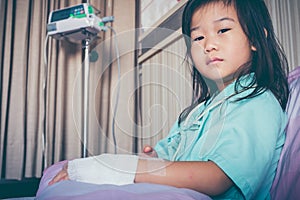 Illness asian child admitted in hospital with saline intravenous