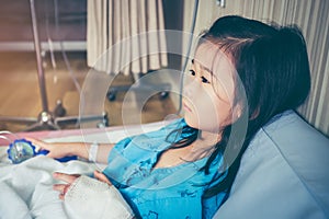 Illness asian child admitted in hospital with saline intravenous