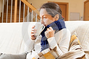 Illness woman in warm scarf