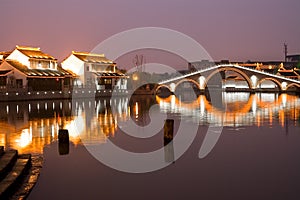 Illumiinated houses and canal at Suzhou