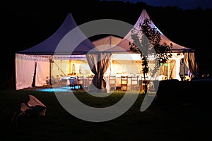 Illuminated afternoon dinnerparty tent photo