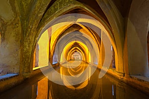 Illuminated ancient baths at the Alcazar in Seville